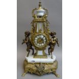 A Louis XVI style gilt metal and white marble mantel clock, 20th century,