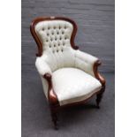 An early Victorian mahogany framed spoon back armchair on reeded baluster supports,