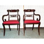 A pair of Regency style mahogany and parcel gilt open armchairs, (2).