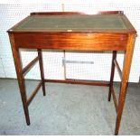 An early 20th century mahogany clerks desk with leather inset and galleried top on tapering square