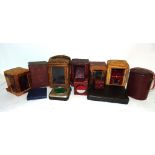 A quantity of carriage clock leather covered carrying cases.