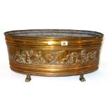 A Victorian oval copper jardiniere, embossed with a band of allegorical cherubs, with a tin liner,