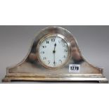 An Edwardian silver plated arch top mantel clock with white enamel dial, 16cm high,