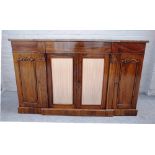 A William IV rosewood breakfront side cabinet, with three flush fit drawers,