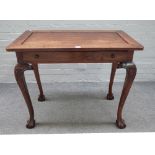 An 18th century style hardwood rectangular single drawer side table on shell capped supports and