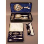 Silver and silver mounted wares, comprising; a lady's five piece dressing set,