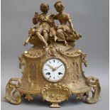 A Louis XVI style gilt metal figural mantel clock, 20th century,