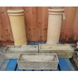 A pair of 20th century stone chimney pots,