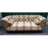 A Victorian Chesterfield sofa, with button striped floral upholstery,