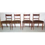 A set of four Regency style mahogany bar back dining chairs on sabre supports, (4).