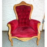 A Louis XVI syle beech fauteuil with red button back upholstery.
