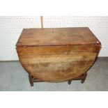 A 20th century oak drop flap dining table, 91cm wide x 50cm high.