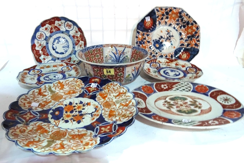 A quantity of 19th century Japanese Imari pattern plates and a matching panelled bowl,