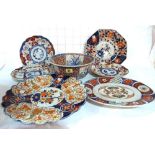 A quantity of 19th century Japanese Imari pattern plates and a matching panelled bowl,