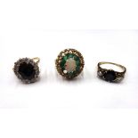 A 9ct gold, opal and emerald set oval cluster ring, (one emerald lacking), a 9ct gold,