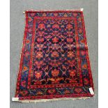 A Mahal rug, Persian, the indigo field with a trellis design, indigo border of palmettes and vine,