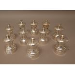 A pair of silver mounted capstan shaped peppermills, each detailed P,