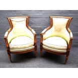 A pair of Louis XVI style stained beech armchairs, with bow seat on baluster turned supports,