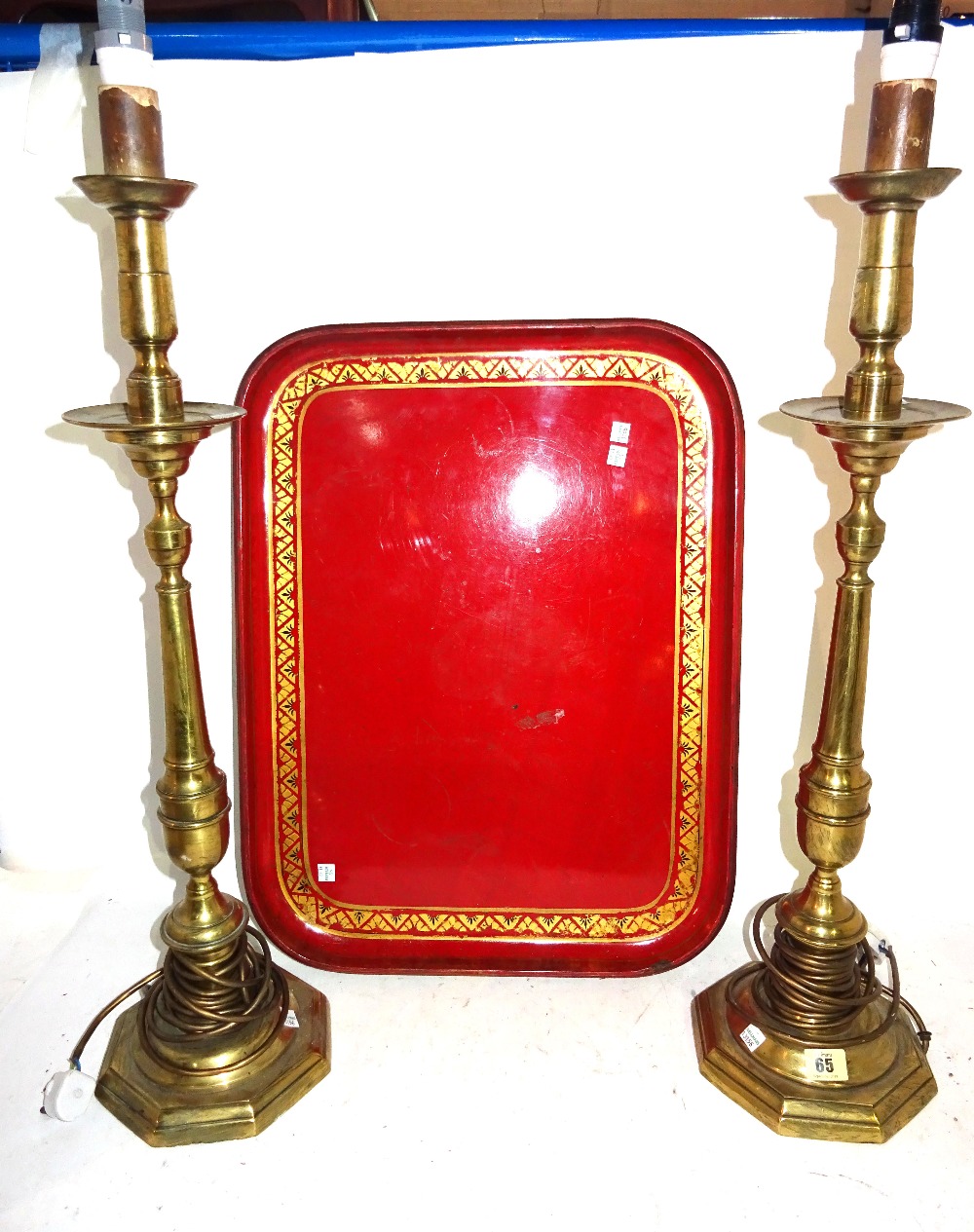 A pair of 20th century brass altar candlesticks on tapering columns and hexagonal bases,