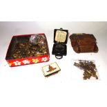 Military collectables including cap badges, buttons, a compass,