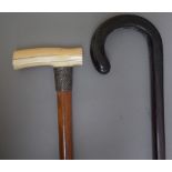 A Victorian malacca walking cane with ivory handle and silver collar (88cm) and a rosewood walking
