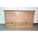 A George III pine mule chest with lift top over a pair of lower drawers, 126cm wide.