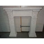 A 20th century white painted fire surround with floral and egg and dart decoration,