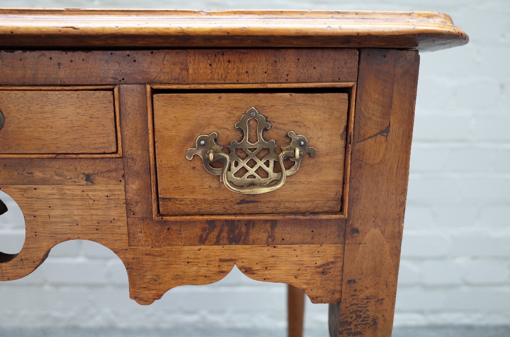 A mid-19th century walnut lowboy with two drawers about the pierced frieze on tapering turned - Image 2 of 3