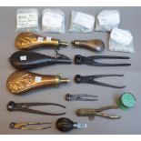 A collection of firearm accoutrements, including; pistol balls and bullets, four powder flasks,