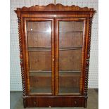 A Victorian rosewood bookcase with single drawer to base flanked by bobbin turned column,