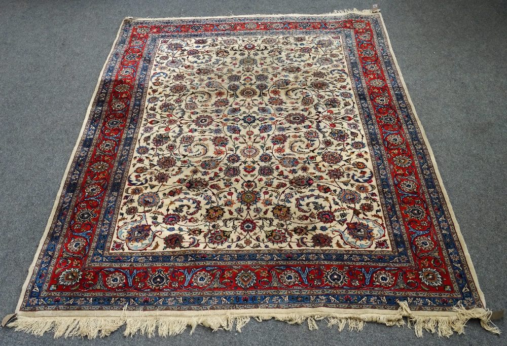 An Esfahan carpet, Persian, the ivory field with an allover palmette flowerhead and floral sprays,