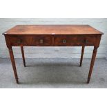 A Regency mahogany rectangular two drawer writing table, on turned supports,