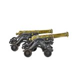 A pair of 18th century style brass cannons,
