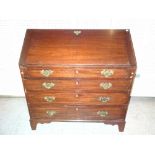 A 19th century oak bureau, the slope front above four graduated drawers and bracket supports,