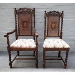 A set of six mid 20th century oak framed dining chairs with carved crest rail and barley twist