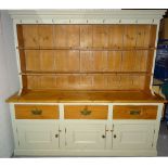 A 20th century grey painted pine kitchen dresser with two shelves and a three tier hanging rack,