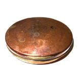 An 18th century oval copper tobacco box with engraved decoration, 10cm wide.