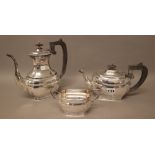 A silver three piece part tea set, comprising; a teapot,