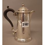 A silver hot water jug, of tapering cylindrical form, in the 18th century taste,