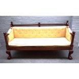 A 19th century mahogany framed hall bench, with fluted turned crest rail and arm supports,