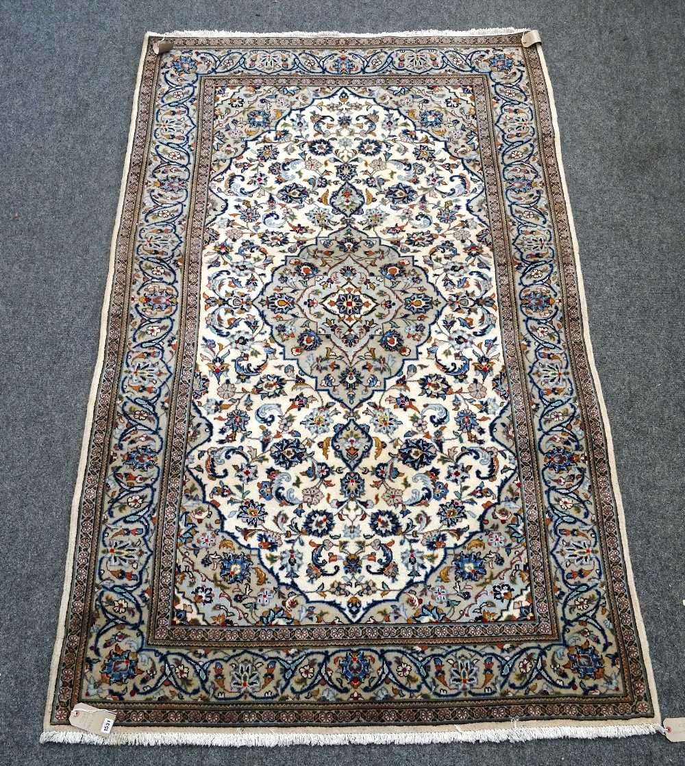A Kashan rug, Persian, the ivory field with a grey medallion, matching spandrels,