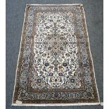 A Kashan rug, Persian, the ivory field with a grey medallion, matching spandrels,