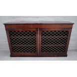 A William IV rosewood floor standing bookcase, with pair of grille doors, on plinth base,