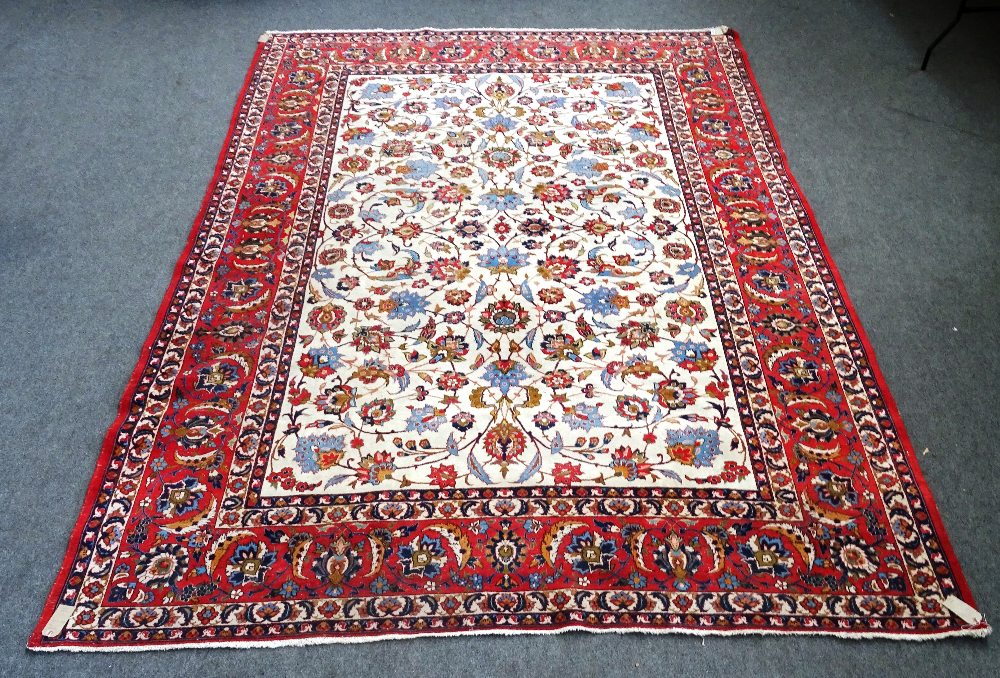 Isfahan carpet, Persian, the ivory field with all over palmette and floral sprays,