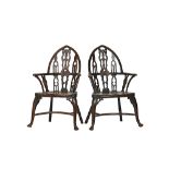 A pair of Strawberry Hill Gothic Revival ash and elm open arm Windsor chairs,