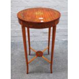 An Edwardian circular satinwood occasional table with painted floral decoration on splayed supports,