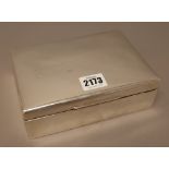 A silver rectangular hinge lidded table cigarette box, wooden lined within,
