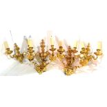 Three pairs of 20th century brass two branch wall lights with cherub finials, 37cm wide x 33cm high,