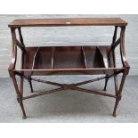 A George III style mahogany free standing book trough, on turned supports,