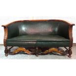 A 20th century oak framed two seat sofa with faux studded green leather upholstery, 123cm wide.